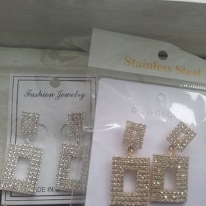 Fashion jewelry silver and gold earrings.